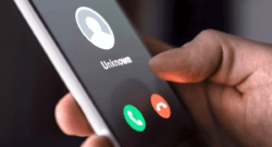 hand-holding-phone-with-unknown-call-coming-in-option-to-accept-or-decline-call