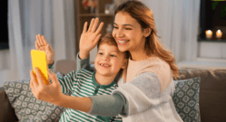mom-and-child-video-calling-on-couch