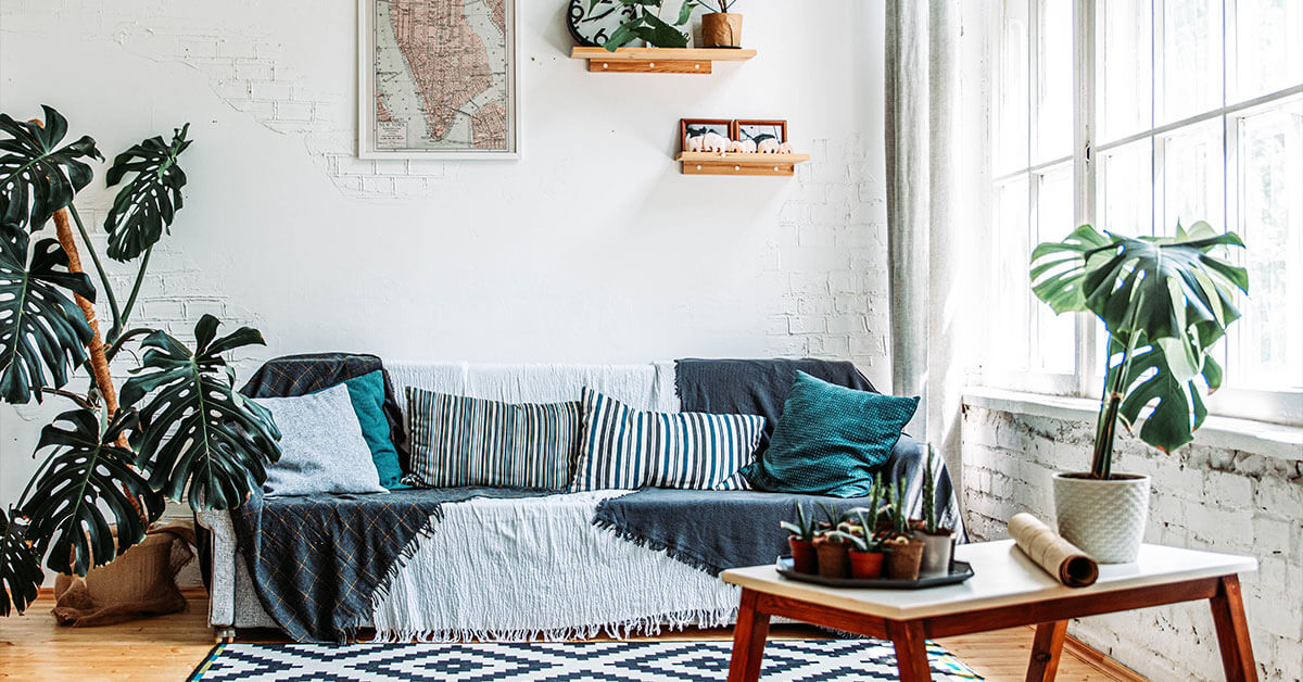 Blue and white bohemian style living room with plants
